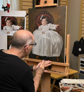 Hayward working on an original oil portrait painting