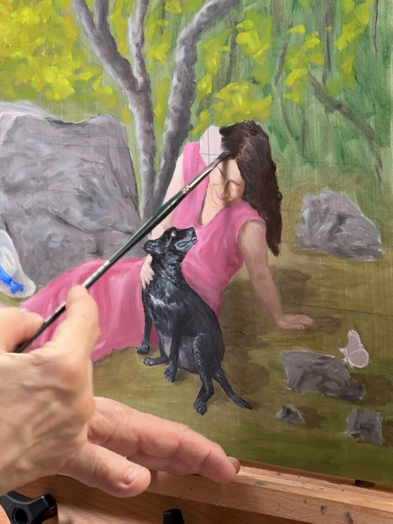 Close-up of Hayward Gaude painting Michelle’s face during the portrait process, showing brushwork and early color layers.