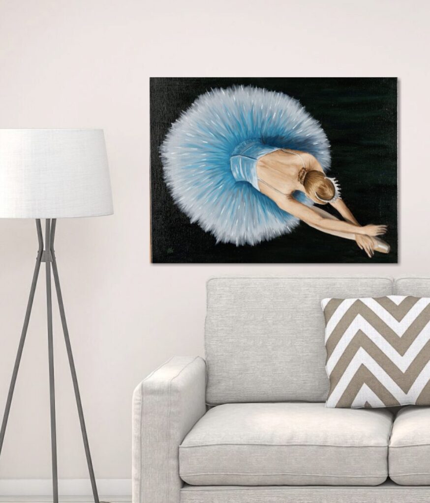 A piece of art above a sofa that is too big